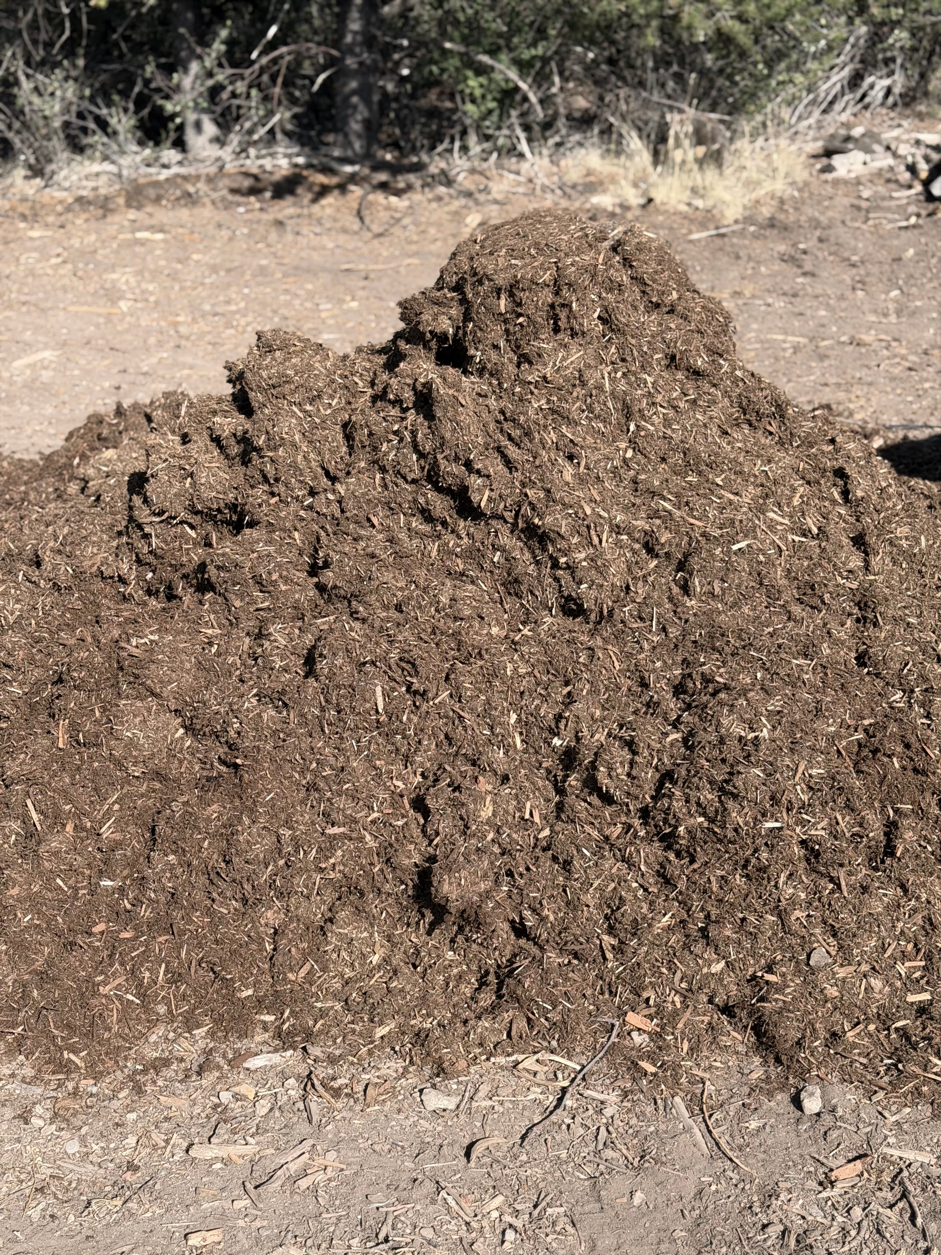 Loose Western Red Cedar mulch pile ready for delivery by the cubic yard in Durango, Colorado