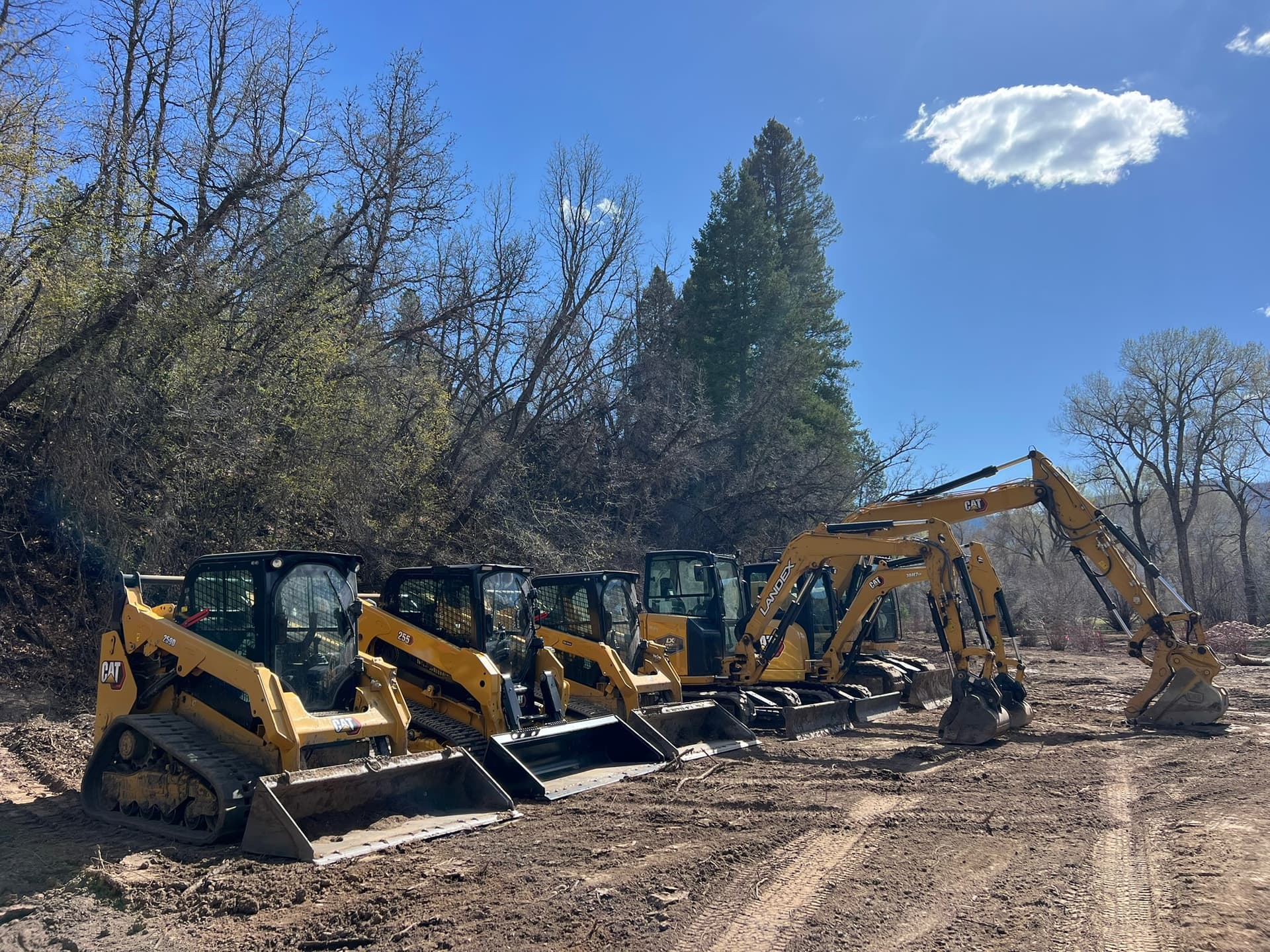 LandEx Earthworks CAT equipment fleet including skid steers and excavators in Durango, Colorado