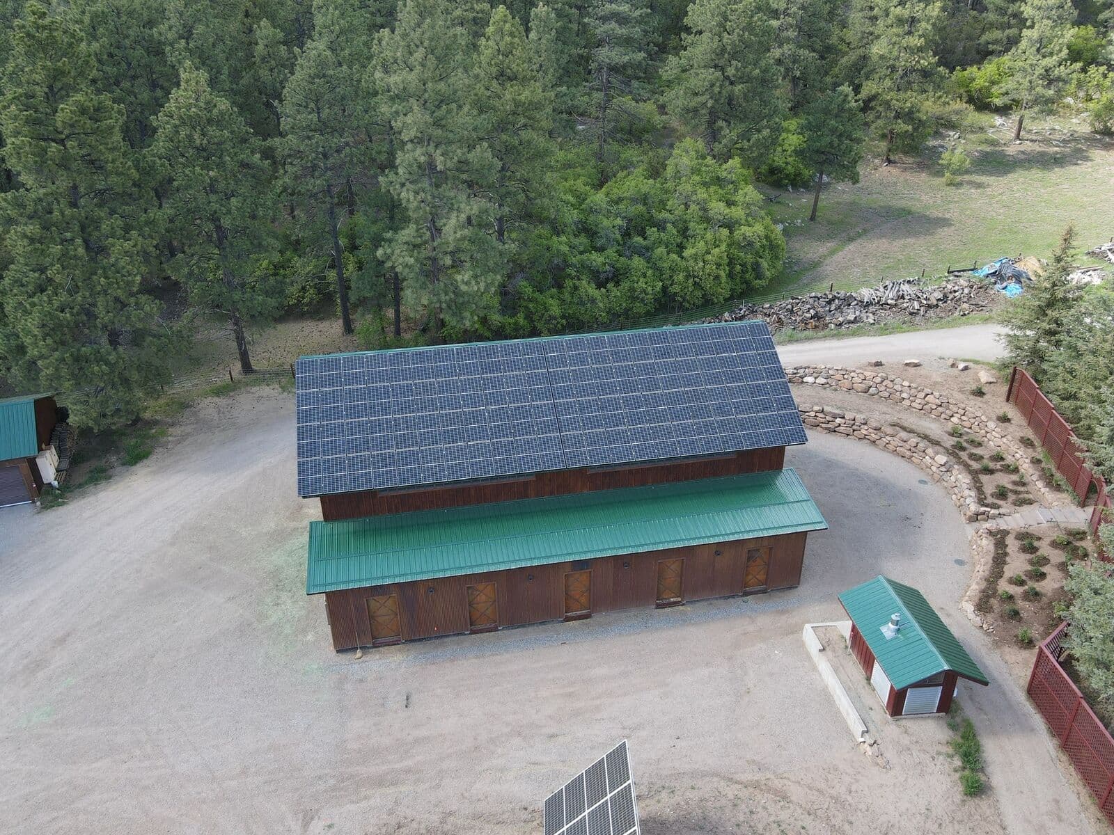 Aerial drone view of completed site work and grading around a barn property in Durango, Colorado