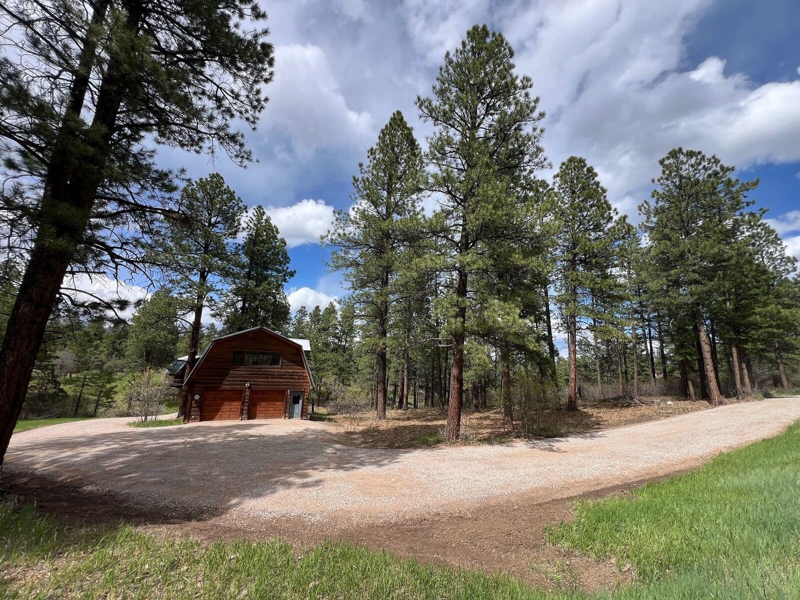 Finished gravel driveway leading to a barn in Durango, Colorado by LandEx Earthworks