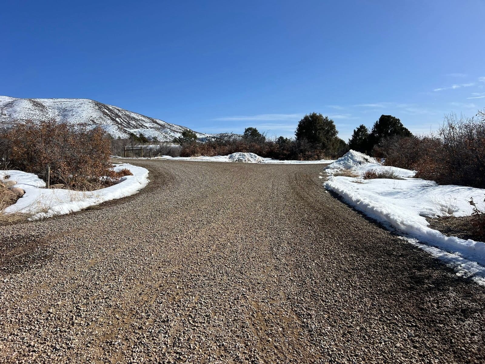 Gravel road construction shown in winter near Durango, Colorado