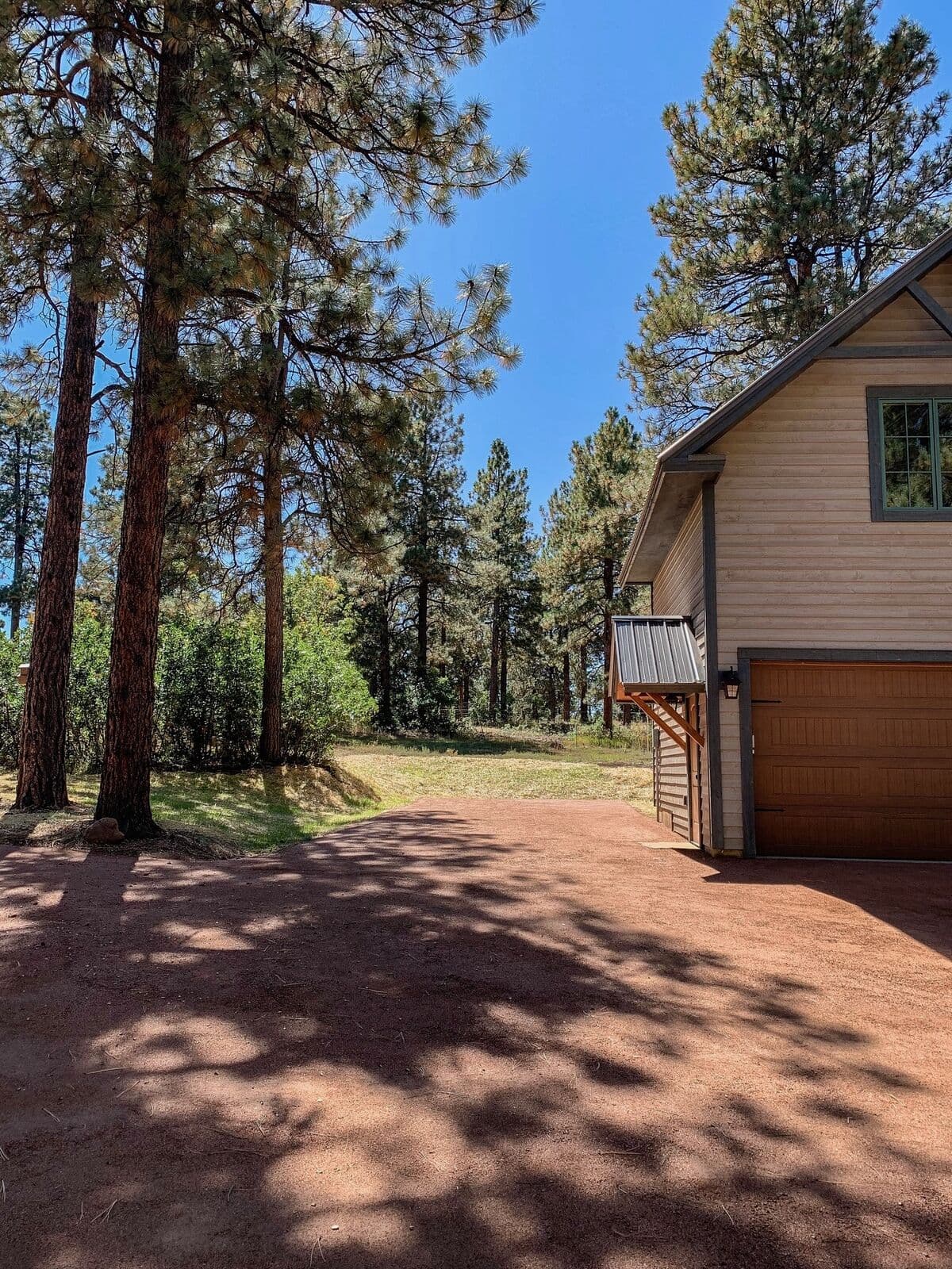 Red cinder pathway graded beside a home in Durango, Colorado