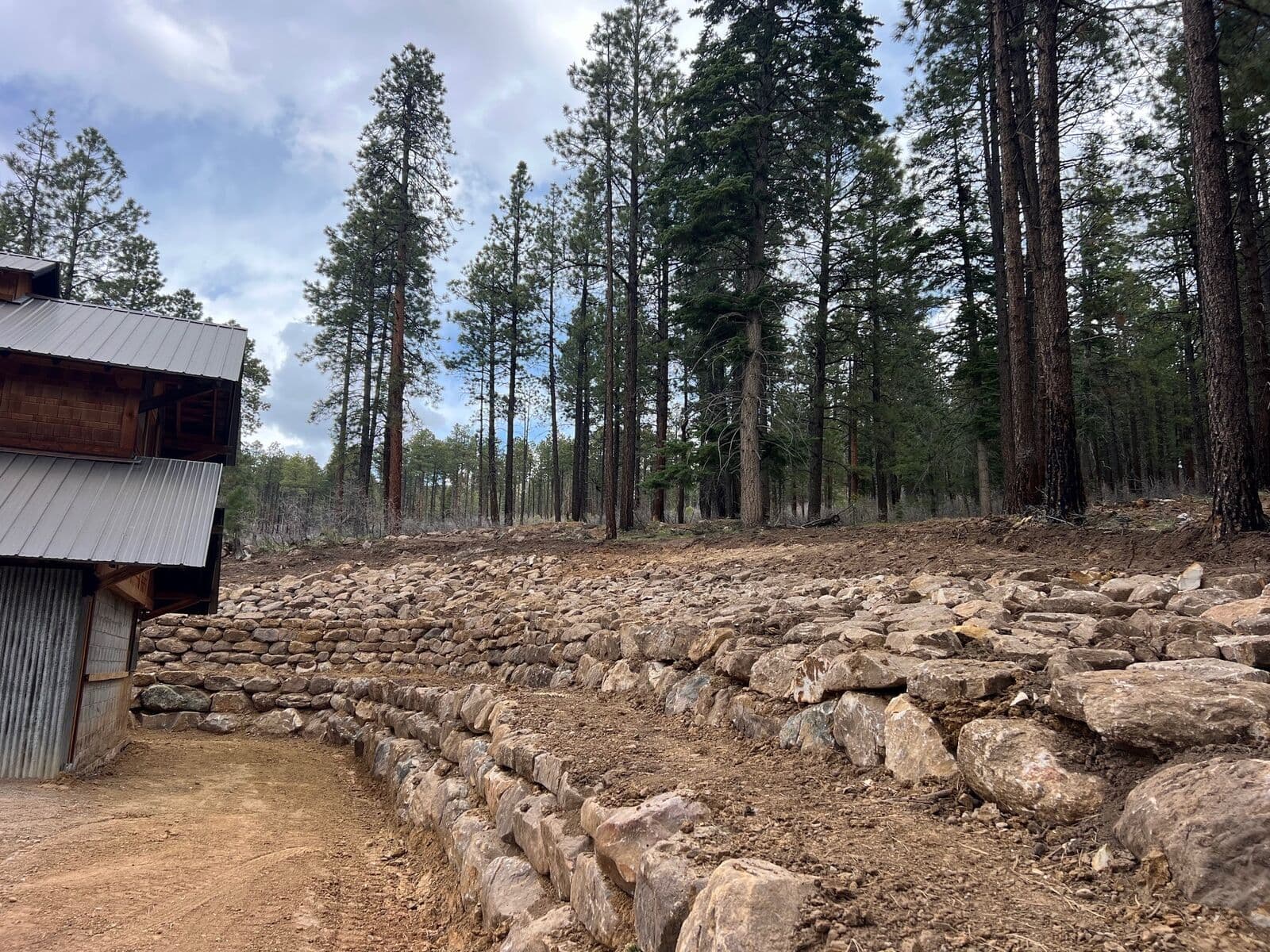 Terraced boulder retaining walls built behind a mountain home in Durango, Colorado